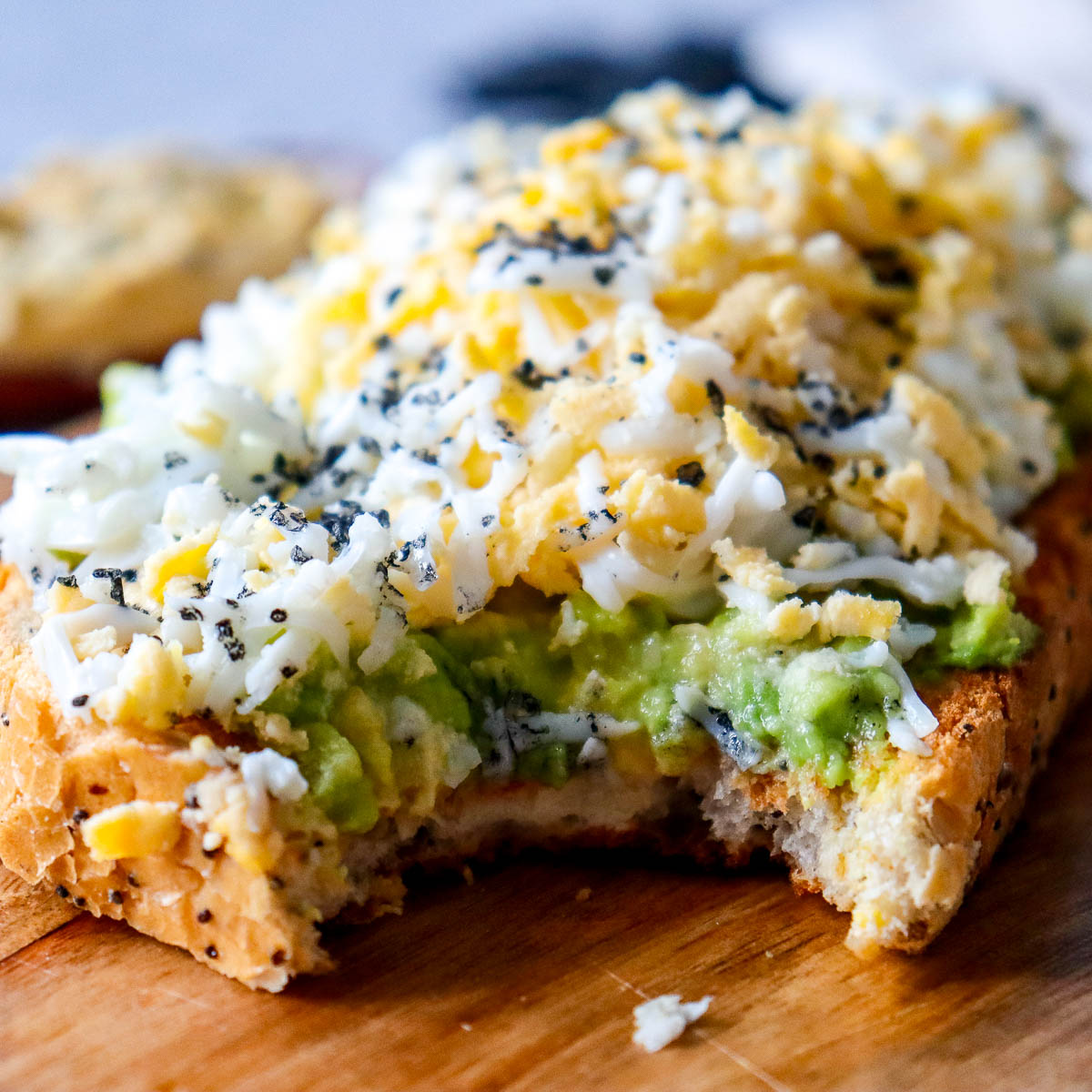 Avocado and Shaved Egg Toast with Hummus and Black Salt