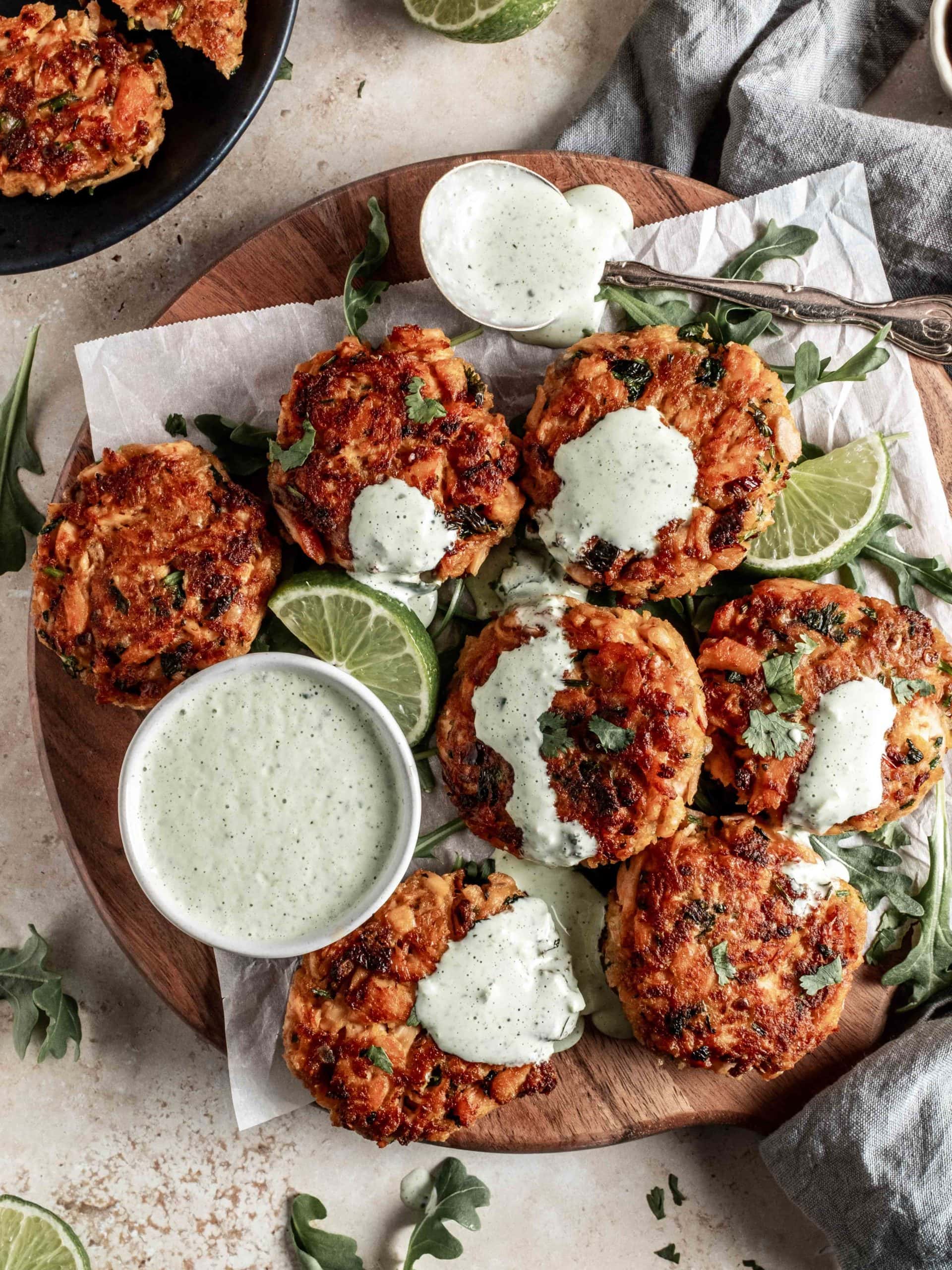 platter of salmon cakes with bowl of cilantro lime aioli