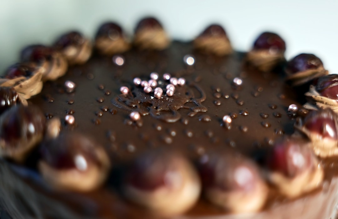 A chocolate cake with cherries on top of it