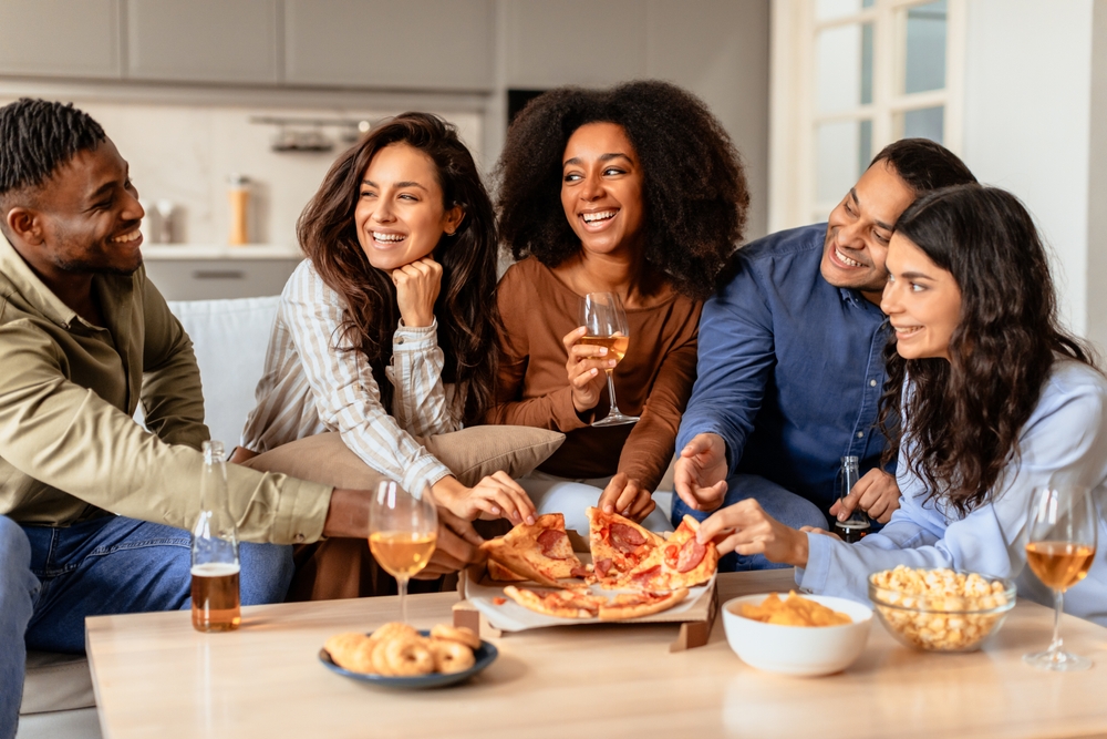 having friends over for drinks and pizza