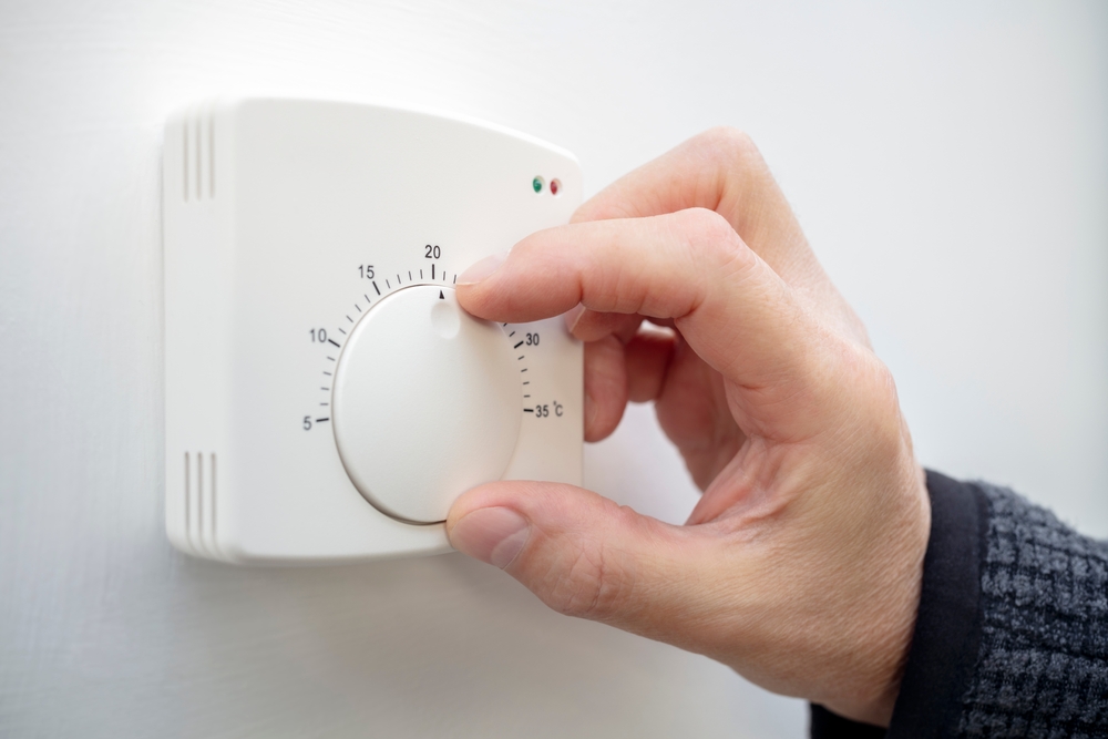 Changing the temperature on a home thermostat