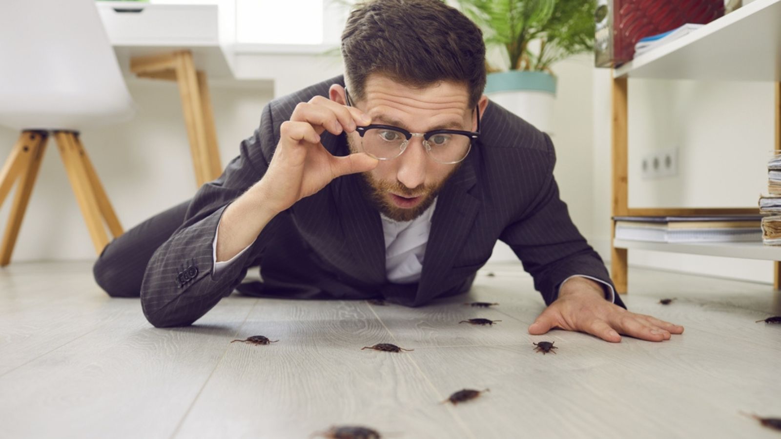 man shocked with roaches on floor