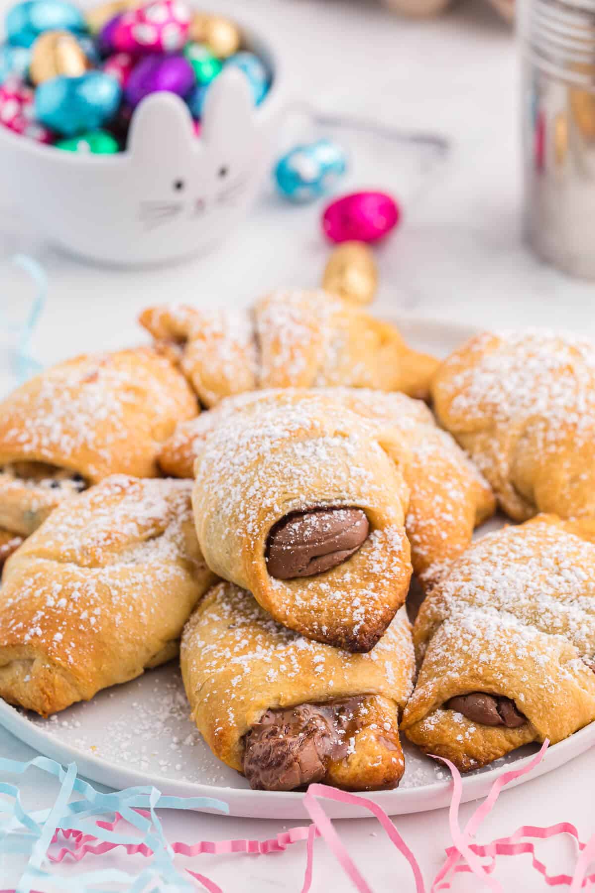 Easter egg stuffed crescent rolls on a plate.