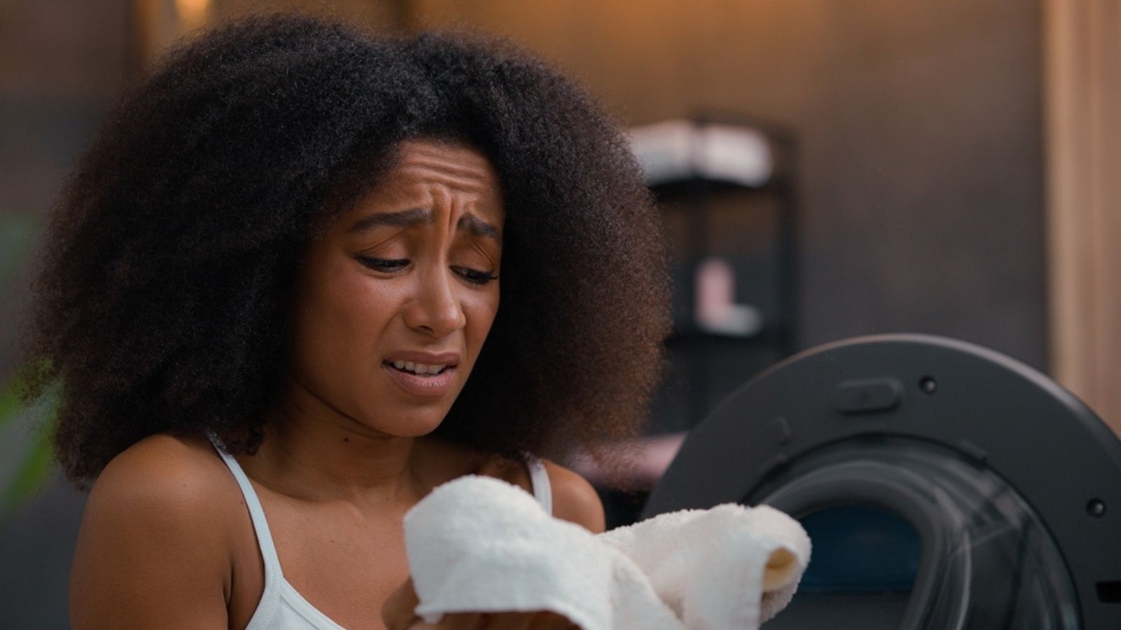 woman unhappy with softness of towels