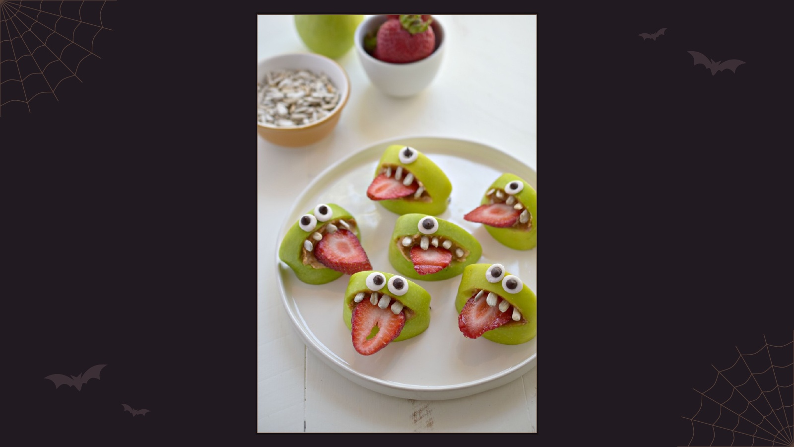 Green apple monster mouths with sunflower seed teeth and strawberry tongues