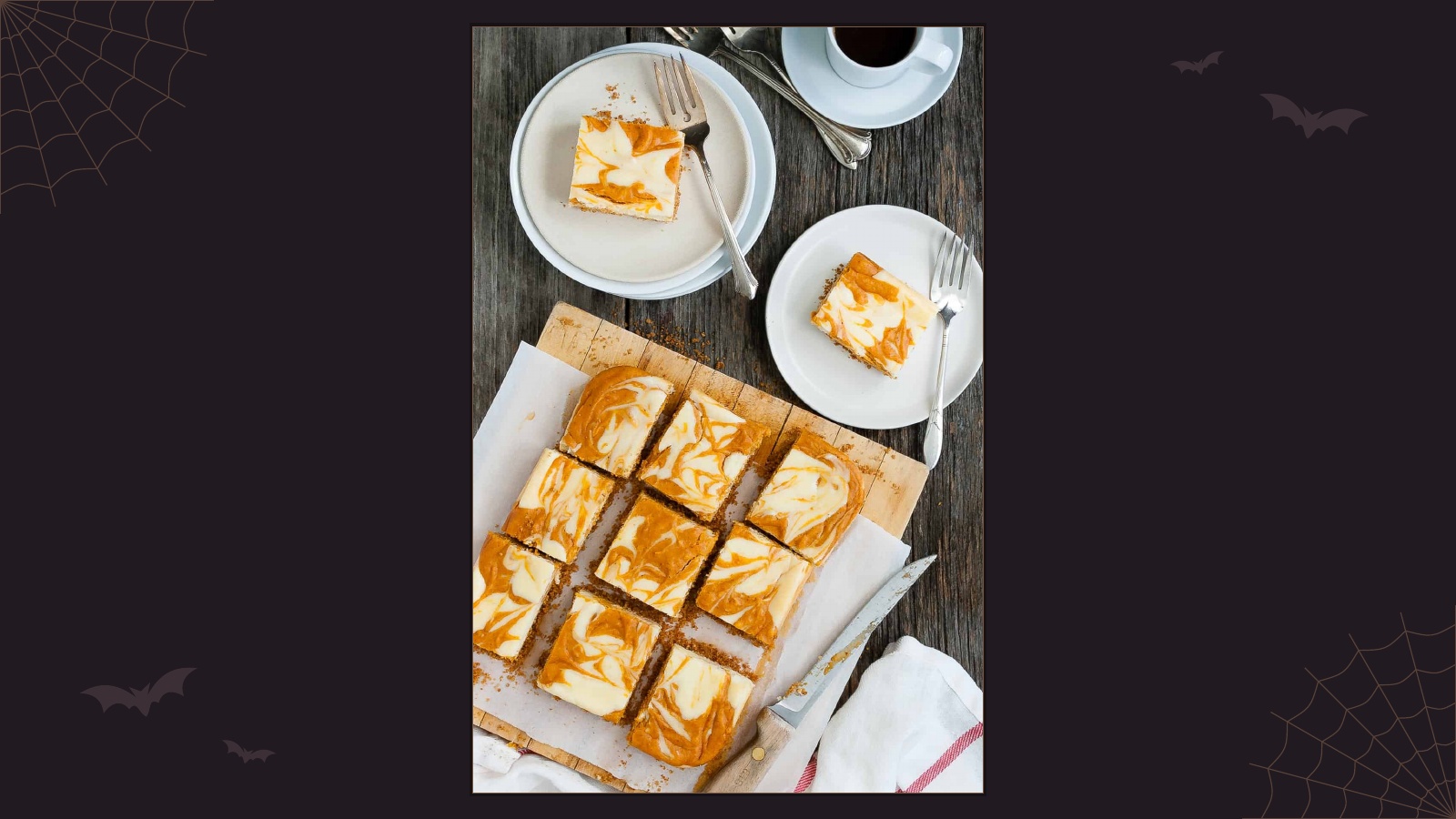 Pumpkin cheesecake bars with orange and white swirls on a graham cracker crust