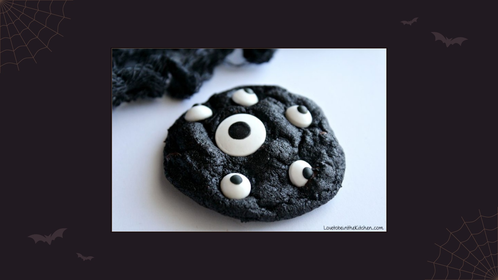 Dark chocolate Halloween cookies decorated with candy eyeballs