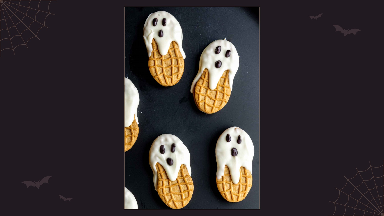 Nutter Butter cookies dipped in white chocolate to look like little Halloween ghosts