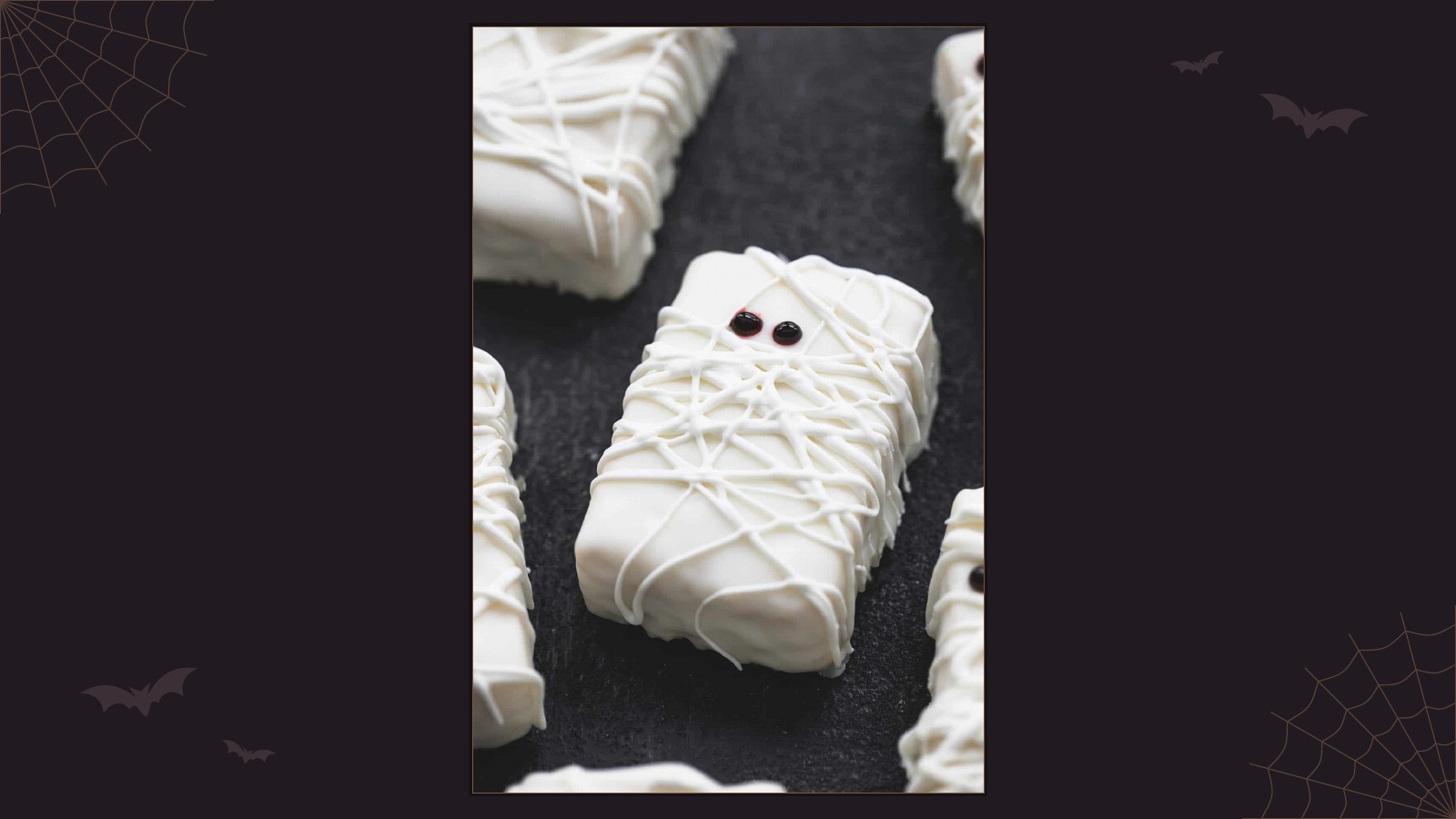 Rice Krispie treats dipped in white chocolate and decorated like mummies