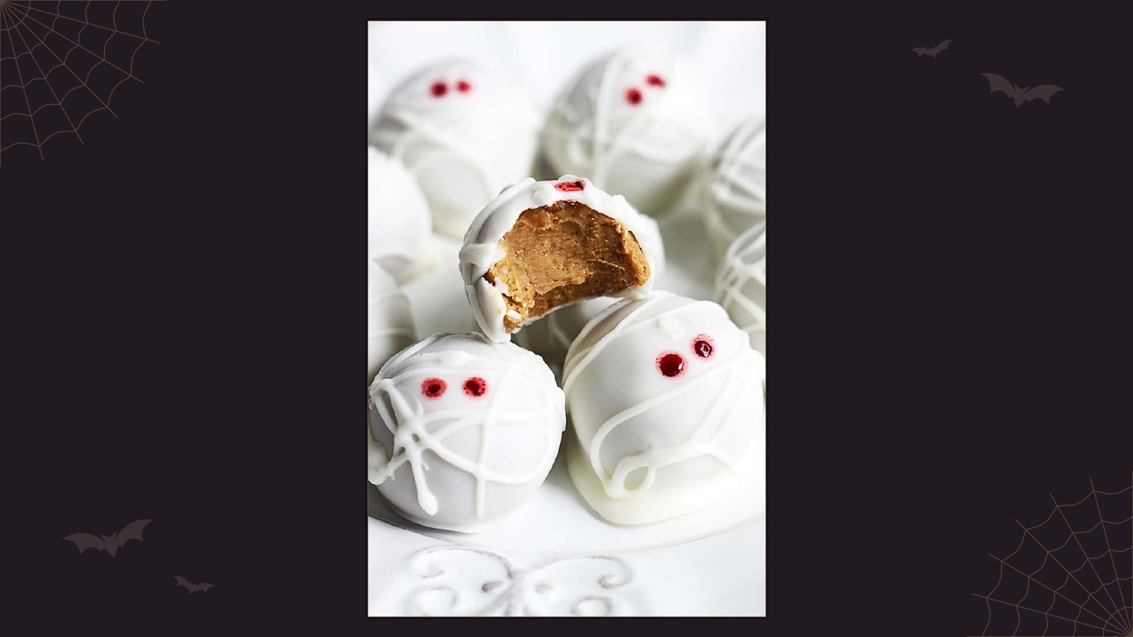 White chocolate mummy truffles with pumpkin cheesecake centers and red eyes