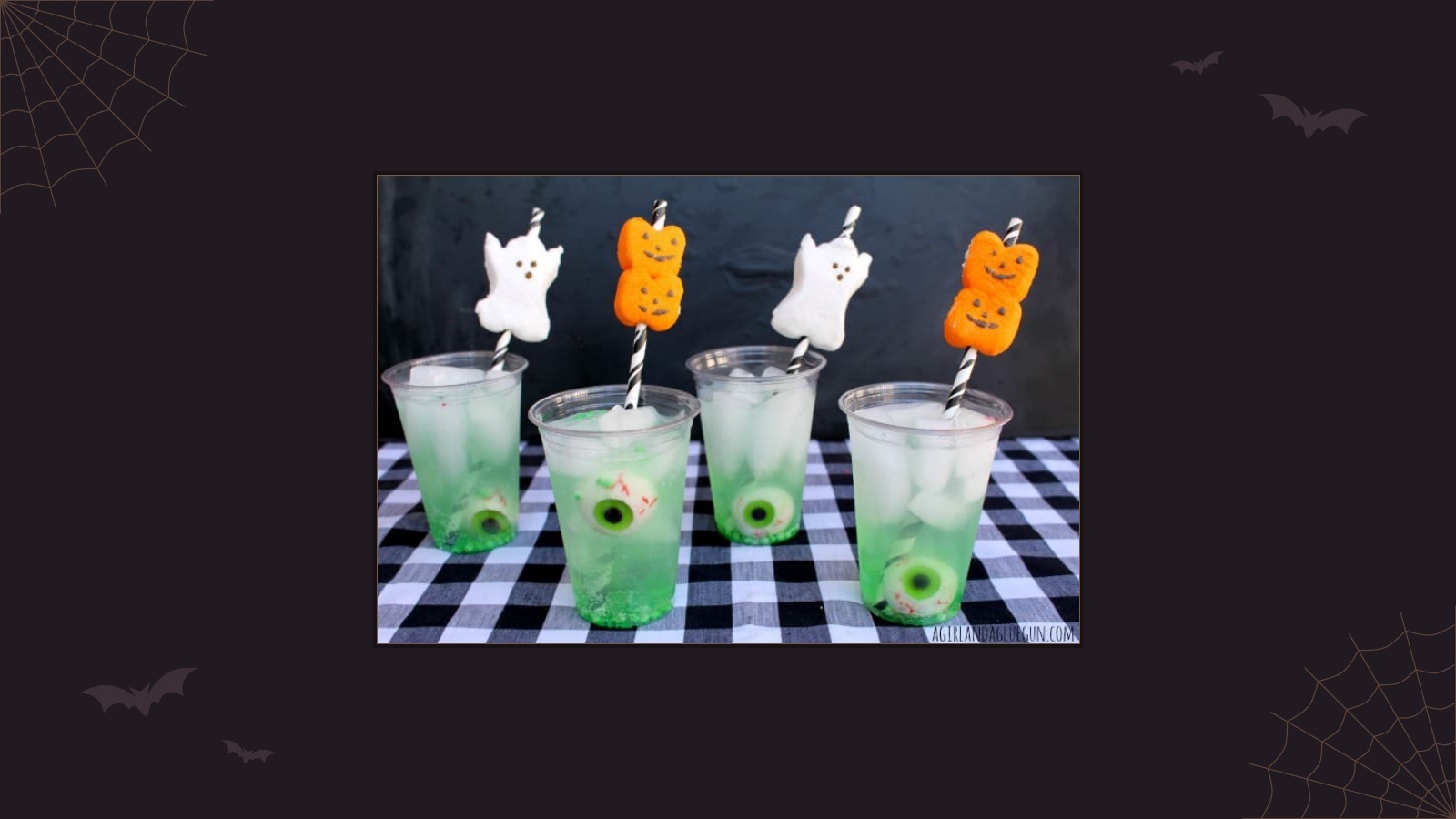 Halloween lemon-lime soda drinks with candy eyeballs and marshmallow ghost and pumpkin straws