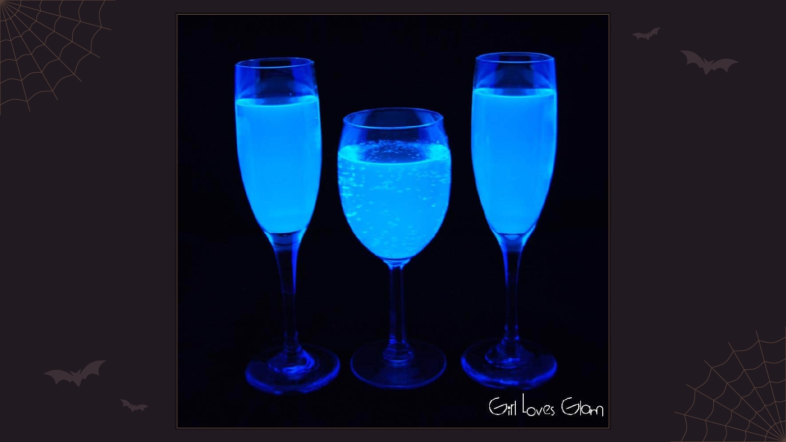 Glasses of lemonade glowing bright blue under ultraviolet black light