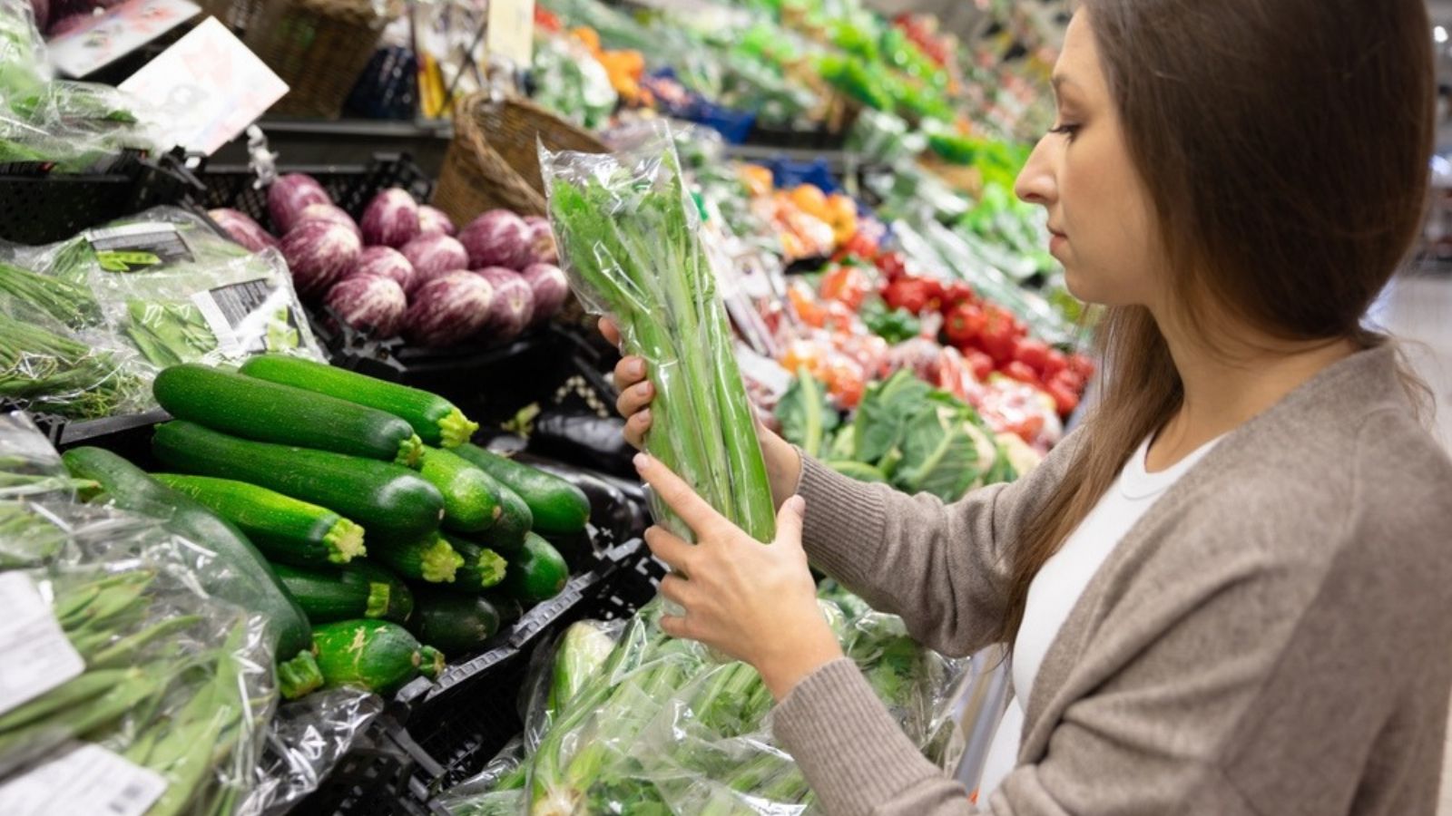 choosing celery at grocery store