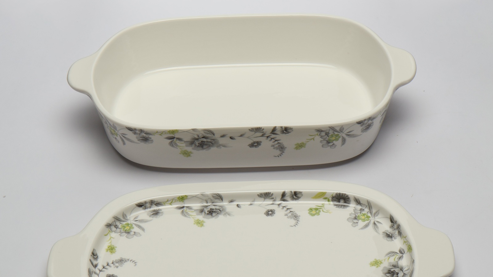 A ceramic casserole dish with a floral pattern