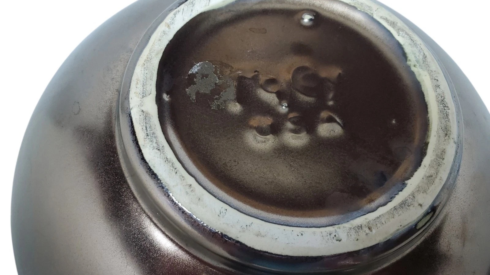 Raised McCoy USA maker mark on a cookie jar base