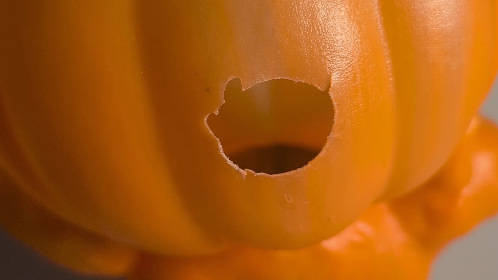Round light opening in the orange back of a General Foam Halloween blow mold