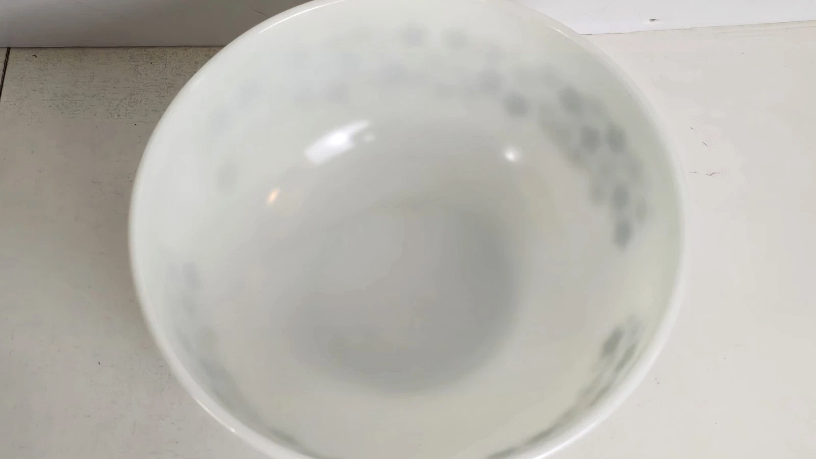 Close view of the white glass interior of a Spring Blossom mixing bowl